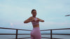 Hero video of a woman stretching in rose gold Lumo EMS toning tights